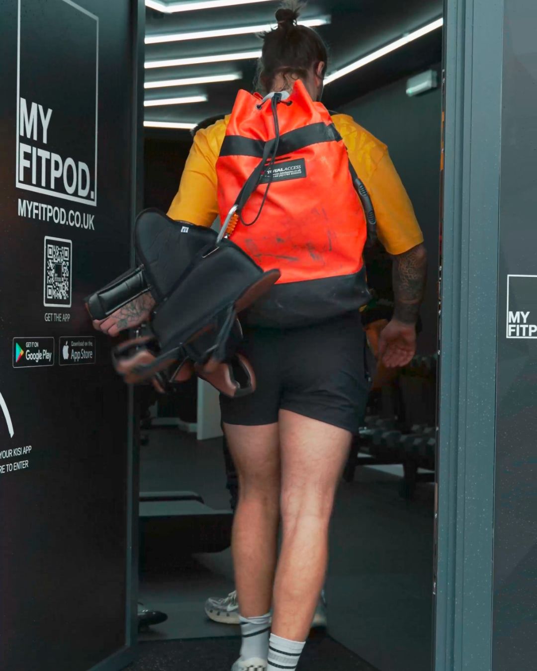 A man walking into My Fit Pod Aylesbury private gym.